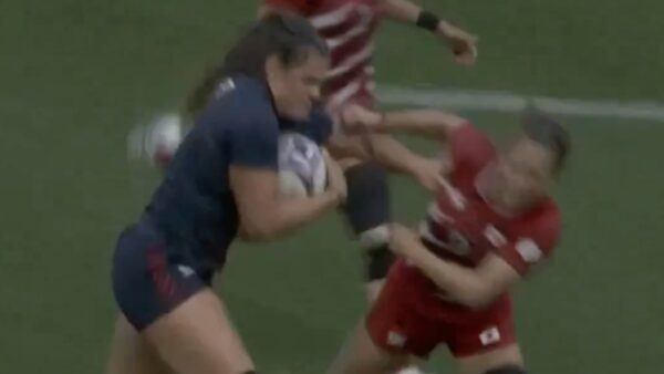 Ilona Maher delivers a stiff arm