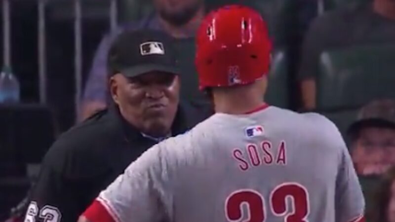 Edmundo Sosa and umpire Laz Diaz discuss a call