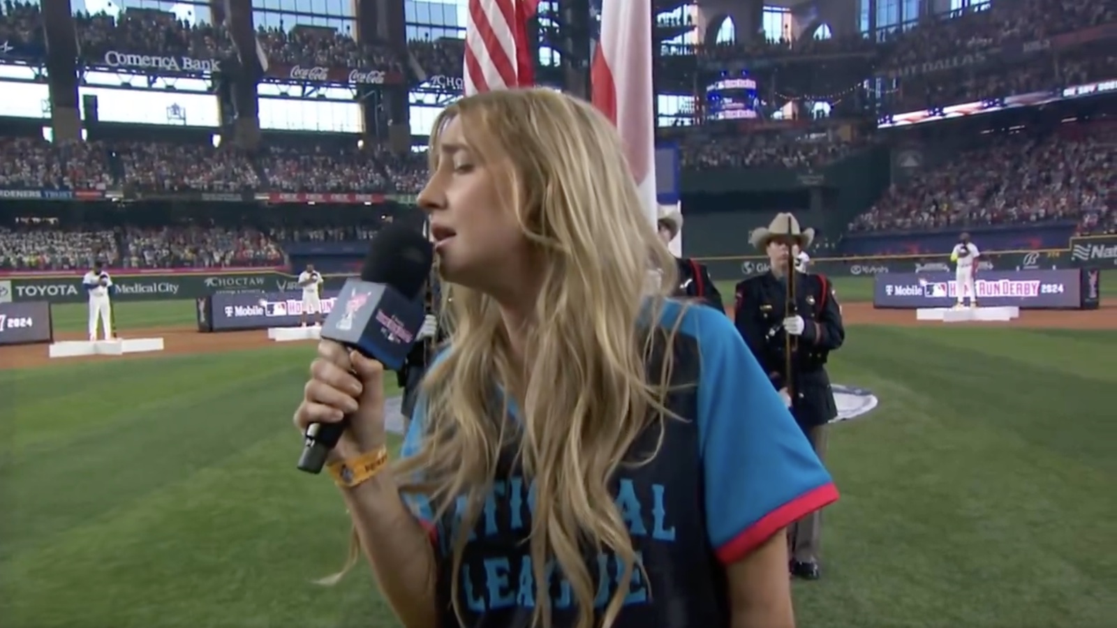 Fans react to the singer’s performance of the national anthem at the Home Run Derby