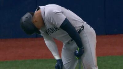 Juan Soto leans over in pain