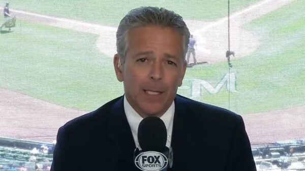 Thom Brennaman holding a mic