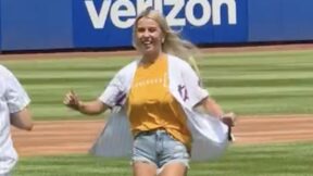 Hailey Welch throws out a first pitch