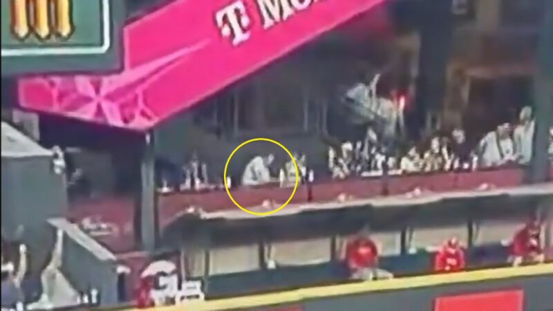 A fan getting hit in the face with a Justin Turner home run