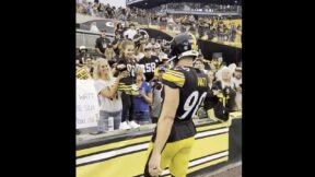 TJ Watt gives his glove to a young Steelers fan