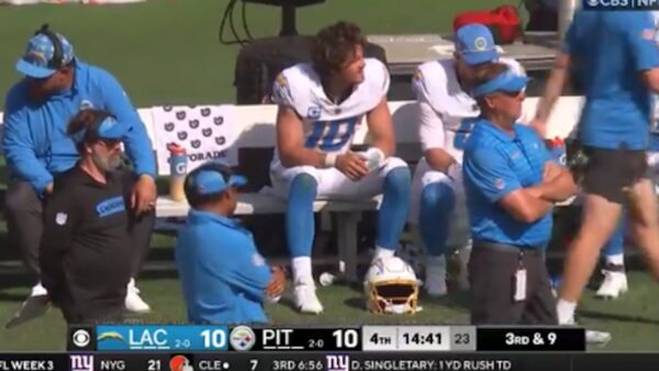 Justin Herbert sits on the bench