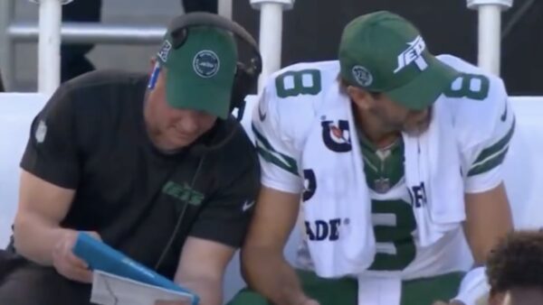 Nathaniel Hackett talks to Aaron Rodgers on the sideline