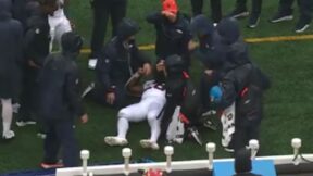 Tyler Badie collapses on the sideline