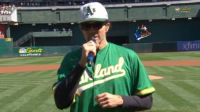 Barry Zito holding a microphone