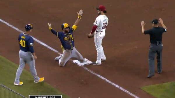 Jackson Chourio celebrating at third base