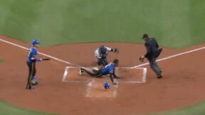 Mariners outfielder Victor Robles tries to steal home against the Yankees