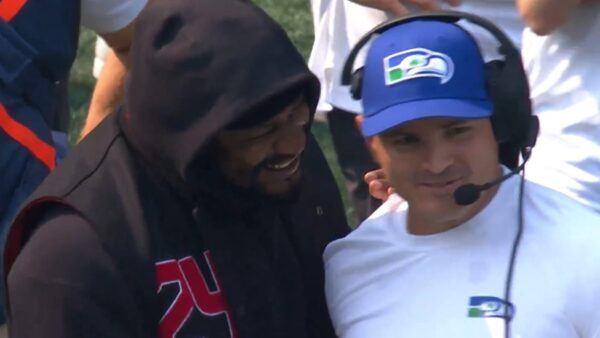 Marshawn Lynch and Mike Macdonald on the sideline