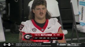 Tate Ratledge rocking a mullet on the sidelines