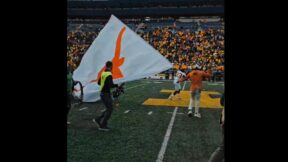 A Texas player holds a flag