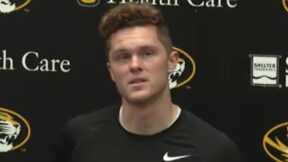 Brady Cook at a press conference