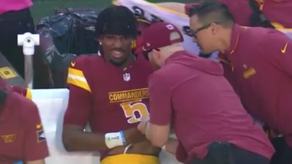 Jayden Daniels gets examined on the sideline