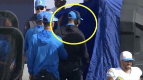 Jim Harbaugh goes into the blue medical tent