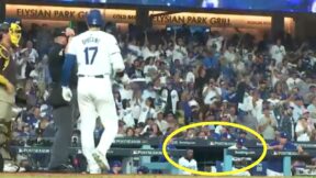 Manny Machado throws a ball toward the Dodgers dugout