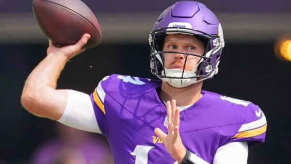 Sam Darnold throws a pass