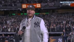 Fat Joe holds a microphone