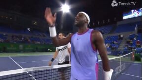 Frances Tiafoe raises his arm