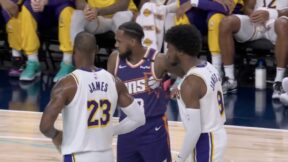 LeBron and Bronny James standing next to each other during a Lakers preseason game