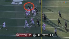 Oregon holder Luke Dunne throwing a pass after a failed PAT attempt vs. Ohio State