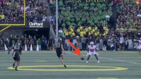 Oregon kicker attempts an onside kick against Ohio State