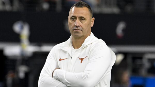 Steve Sarkisian with arms folded