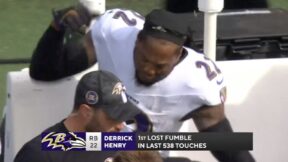 Derrick Henry punches the bench