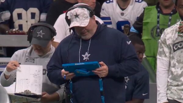 Mike McCarthy looks at a tablet