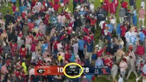 Ole Miss fans storm the field before the game ends