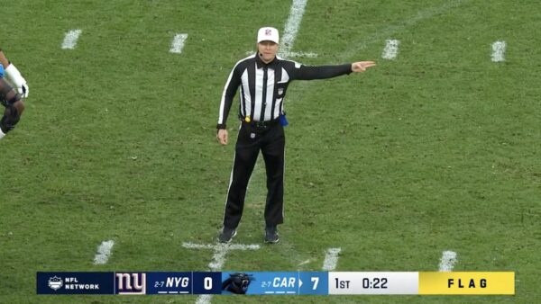 Shawn Hochuli makes a penalty call