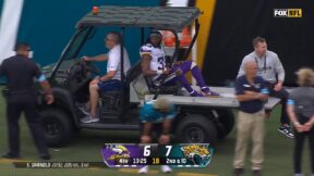 Aaron Jones being carted off