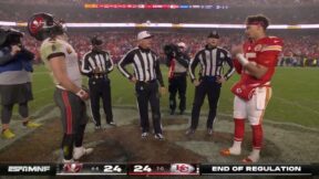 Buccaneers QB Baker Mayfield reacting to the coin toss in front of Chiefs QB Patrick Mahomes