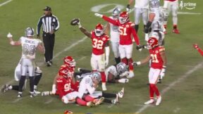 Chiefs players hold up the ball