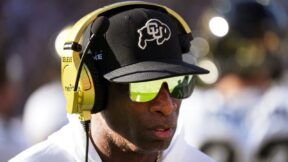 Deion Sanders with a headset on