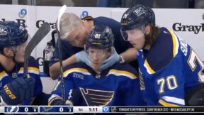 Blues forward Dylan Holloway receiving treatment on his neck injury