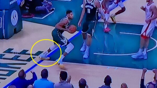 Giannis Antetokounmpo stepping out of bounds