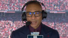 Gus Johnson with a headset on