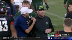 USF coach Alex Golesh and Florida Atlantic head coach Tom Herman get heated