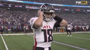 Kirk Cousins walks onto the field