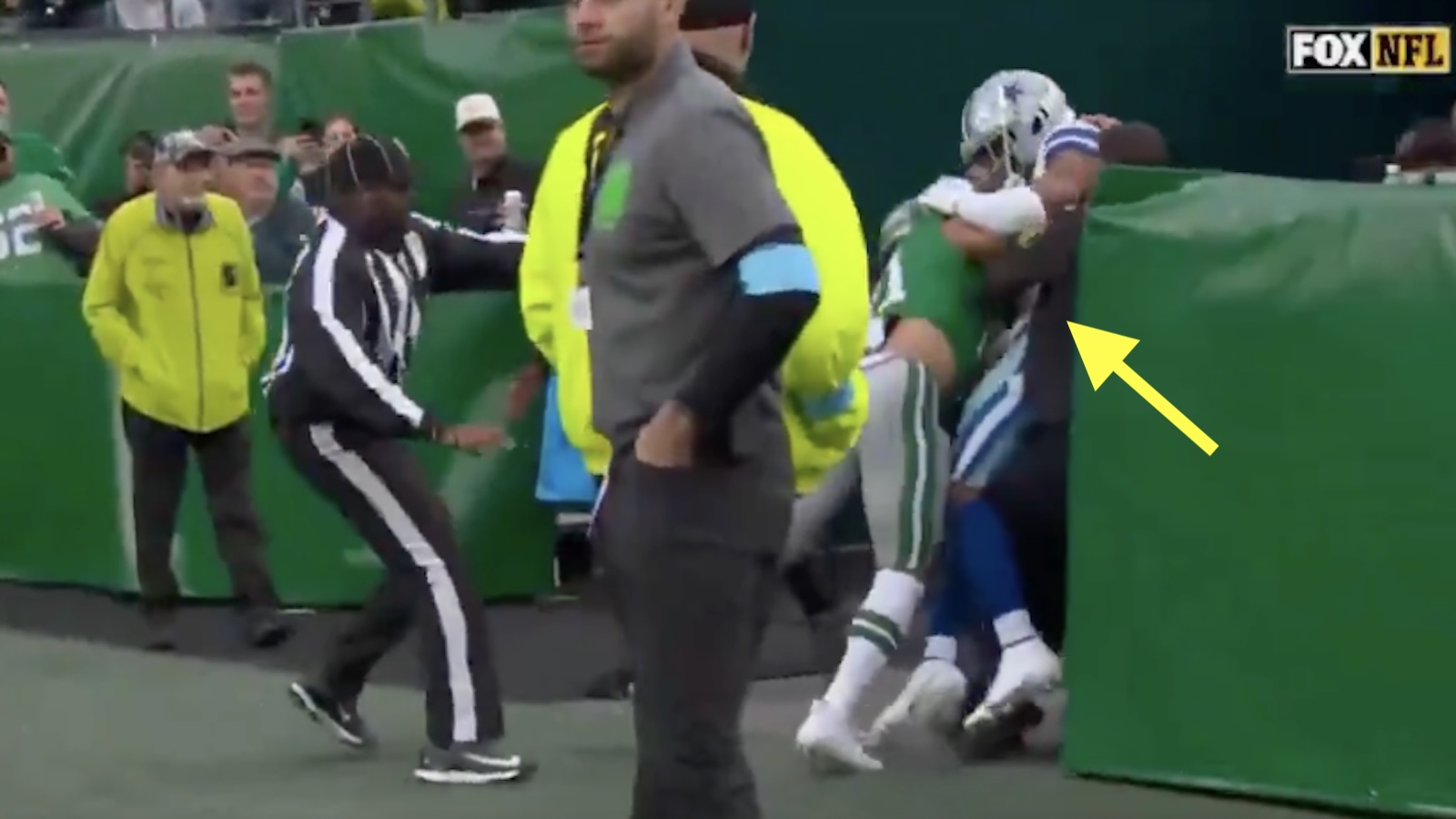 Sydney Brown and Troy Pride fight near the tunnel