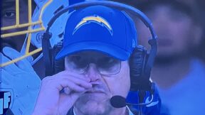 Jim Harbaugh holds a smelling salt