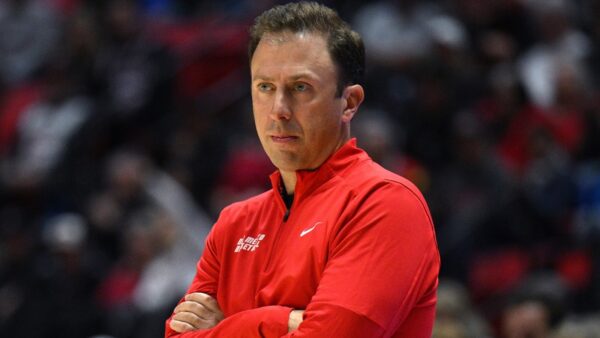 Richard Pitino looking on