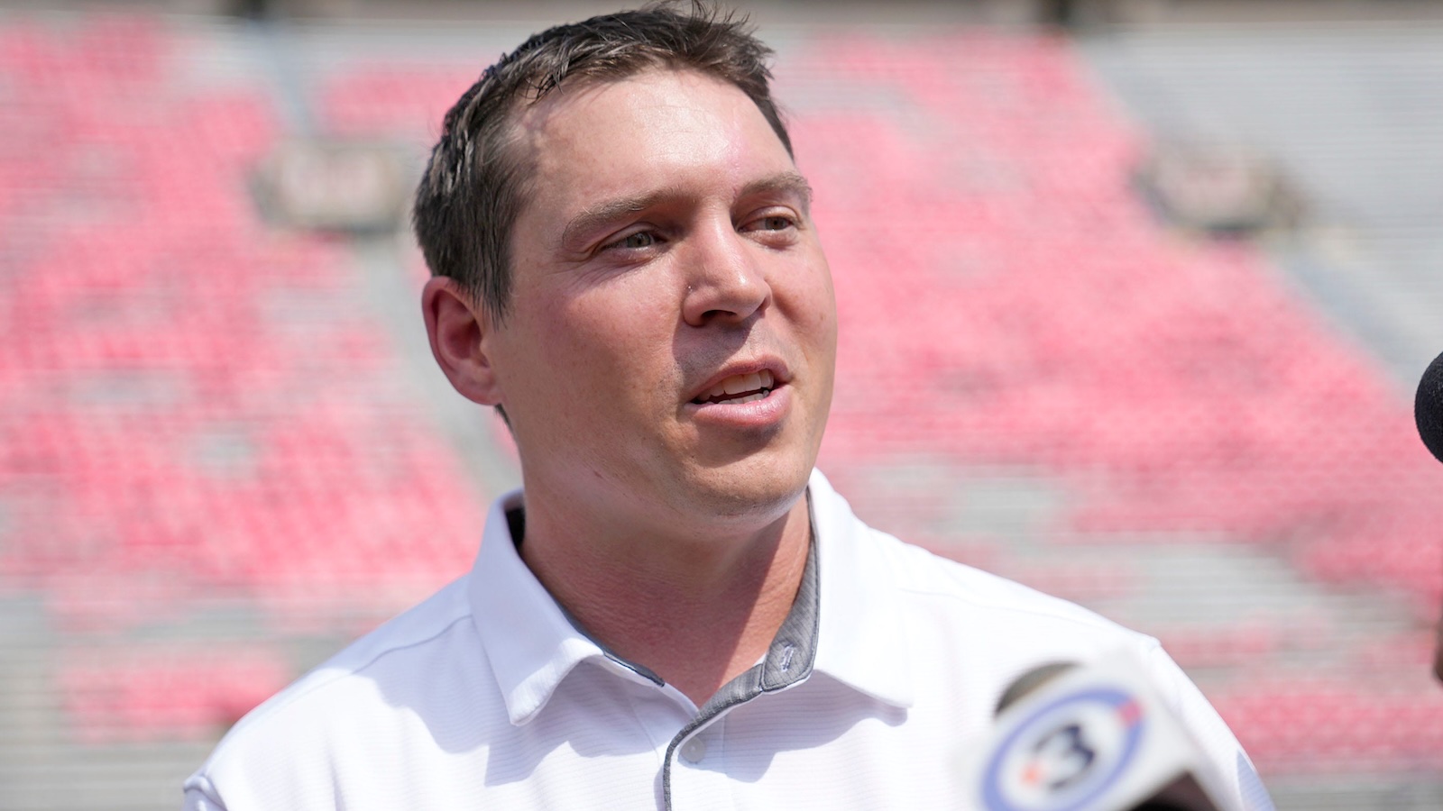 Jim Leonhard speaks with reporters