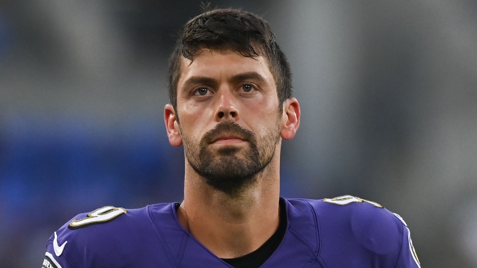 Justin Tucker looks on