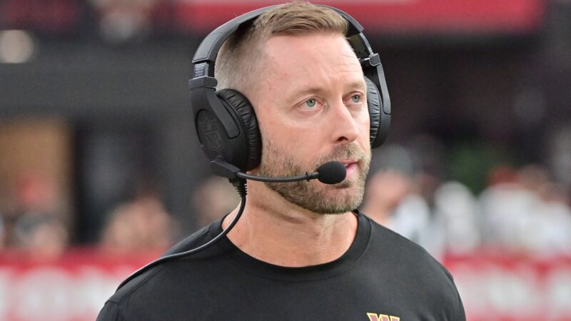 Kliff Kingsbury looks on