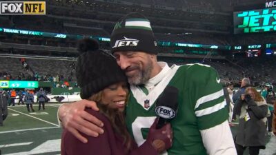 Aaron Rodgers hugs Pam Oliver