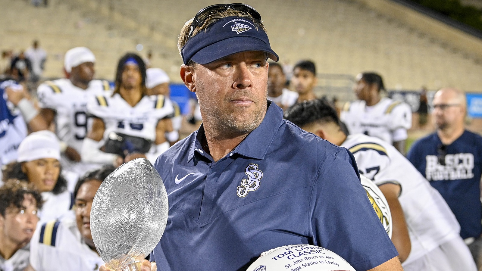 Jason Negro holds a trophy