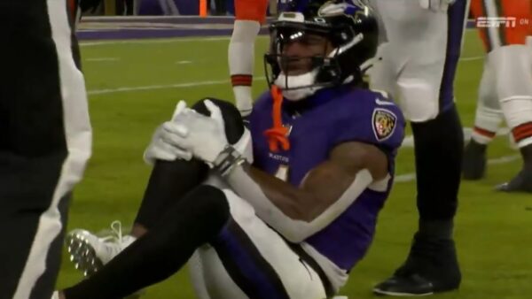 Zay Flowers grabbing his knee in pain